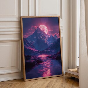 May include: A framed vertical wall art print featuring a mountain landscape at night. The scene displays a large, glowing full moon behind a jagged, snow-capped mountain peak, with deep purple and pink hues reflecting on a calm lake below.