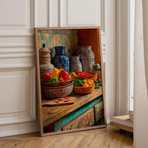 May include: A framed print depicting a kitchen scene with ceramic bowls and jars filled with red, yellow, and green bell peppers, chili peppers, and oranges. The artwork features a wooden countertop, patterned tiles, and vibrant, colorful pottery.