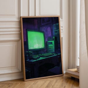 May include: A framed digital art print showing a retro computer setup. The artwork features a green-screen monitor, keyboard, and speakers, with a purple and green colour scheme. The scene is lit by a window with blinds.
