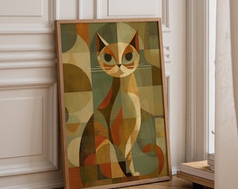 May include: A framed rectangular wall art print featuring a stylised cat composed of geometric shapes and lines. The artwork uses a colour palette of muted greens, warm oranges, browns, and cream tones, depicting a seated cat with large eyes.