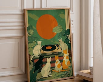 May include: A framed rectangular art print featuring a green background with a large orange circle. The illustration depicts five cats of various colours gathered around a record player surrounded by large green tropical leaves and foliage.