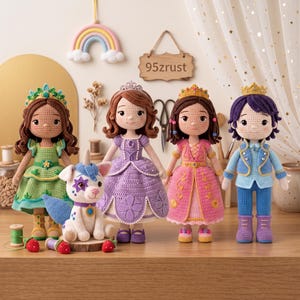 May include: Four crocheted dolls and one small crocheted animal figure. The dolls include three figures in dresses with crowns and one figure in a blue outfit with a crown. The animal is white with blue accents. A wooden sign reads 95zrust.