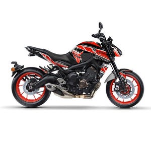May include: A black and red Yamaha MT-09 motorcycle with a striking graphic design. The motorcycle features red wheels, a black seat, and a detailed engine. The design includes the Yamaha logo and MT-09 branding.