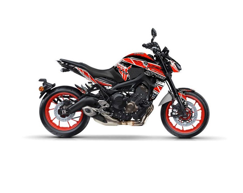 May include: A black and red Yamaha MT-09 motorcycle with a striking graphic design. The motorcycle features red wheels, a black seat, and a detailed engine. The design includes the Yamaha logo and MT-09 branding.