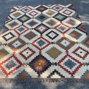 Geometric Kilim Rug
Brown Black Rug
Boho Tribal Rug
Handmade Wool Jute
Rustic Farmhouse Rug
Durable Jute Rug
Bohemian Home Decor
Tribal Geometric Rug
Gifts for Pets
Personalised Gifts
Wool Jute Kilim Rug


Handwoven Dhurrie


Indian Kilim Rug


Olive Green Rug


Vintage Dhurrie


Abstract Pattern Rug


Boho Home Decor


Flat Weave KilimBrown Black Rug
Wool Jute Rug
Natural Fibre Rug
Beige Jute Carpet
Red Black Motif Rug
Statement Floor Rug
Artisan Woven Rug
Modern Bohemian Rug
Ethnic Geometric