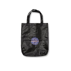 May include: Black tote bag with a circular patch featuring text and a globe design. The bag has two handles and is made of a textured material. The patch is blue, white, and orange.