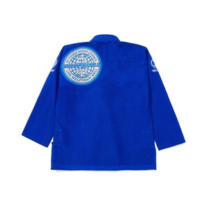 May include: A royal blue martial arts uniform, or gi, with long sleeves. The back features a circular emblem with the text "BY CHOICE NOT BY CHANCE" and "LIVE WELL TRAIN WELL". The gi is designed for training and competition.