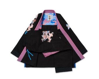 May include: Black martial arts uniform with pink and blue accents. The jacket and pants feature embroidered dragon designs. The collar and trim are pink, with blue accents on the jacket and pants. The interior lining has a blue and pink camouflage pattern.