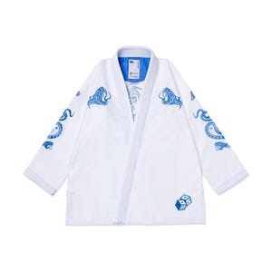 May include: White martial arts gi with blue snake and dice graphics. The gi features blue snake designs on the sleeves and shoulders, with a dice graphic near the bottom. The collar has a blue lining.