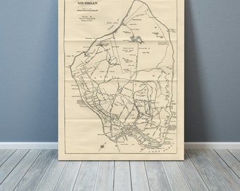 May include: A vintage map of Mackinac Island, Michigan, showing roads, landmarks, and the surrounding water. The map is printed on aged paper with a light brown color.