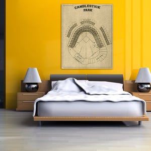 May include: A vintage-style illustration of Candlestick Park, a former baseball stadium in San Francisco, California. The illustration shows the layout of the stadium, including the seating areas, the field, and the surrounding area. The illustration is printed on a beige background and framed in a black frame.