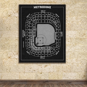 May include: Black and white vintage style seating chart for the Metrodome, a baseball stadium. The chart shows the seating layout, including the field, the stands, and the gates. The text "Metrodome" is at the top of the chart.