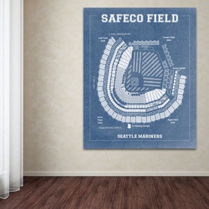 May include: A blue and white blueprint style illustration of Safeco Field, home of the Seattle Mariners baseball team. The illustration shows the seating chart and layout of the stadium.