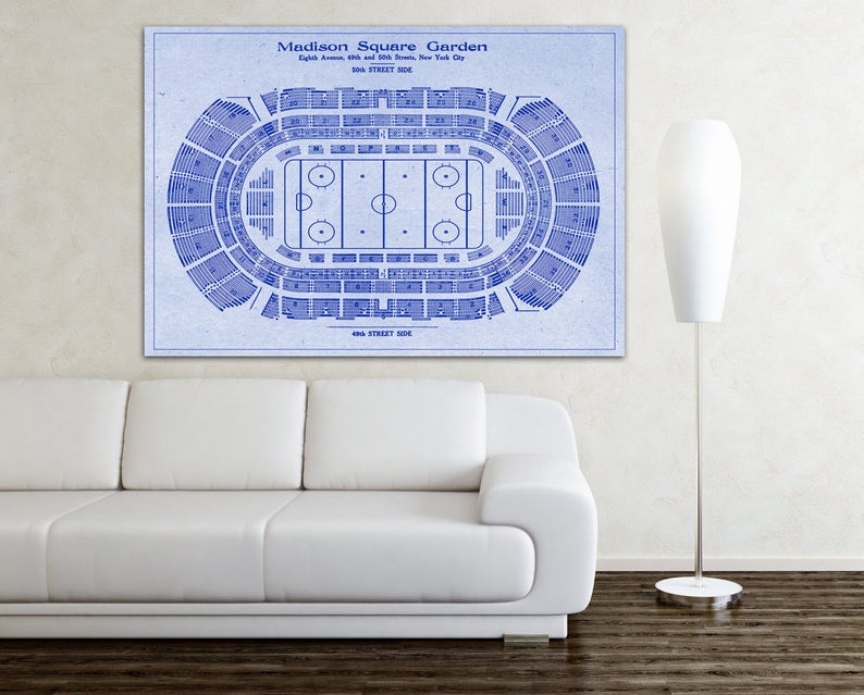 May include: A blueprint style diagram of Madison Square Garden, a famous arena in New York City. The diagram shows the seating layout and the ice hockey rink.