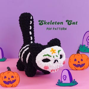 May include: A black crocheted cat plush with a white skull-shaped face featuring green and orange embroidery. The cat has a white skeletal rib cage pattern on its back and a long tail. The text "Skeleton Cat PDF PATTERN" is visible above the cat.