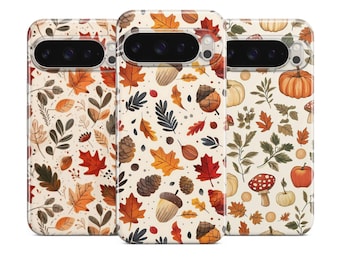 May include: Three phone cases with autumn-themed designs. The cases feature illustrations of fall leaves, acorns, pumpkins, and mushrooms in shades of orange, red, and brown against a cream background. The cases are designed to fit a smartphone.