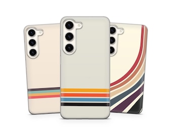 May include: Three phone cases with retro-style designs. The cases are off-white with colorful horizontal stripes in orange, blue, and black. One case has curved stripes in shades of red, orange, and brown. The cases have camera cutouts.