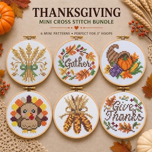 May include: A Thanksgiving mini cross stitch bundle featuring six circular wooden hoops with embroidered designs including wheat, a wreath with the word Gather, a cornucopia, a turkey, corn, and the text Give Thanks, all on white fabric.