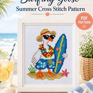 May include: A framed cross stitch pattern titled Surfing Goose Summer Cross Stitch Pattern featuring a white goose wearing a straw hat, sunglasses, and a floral lei, holding a blue surfboard while standing on sand in blue swim trunks.