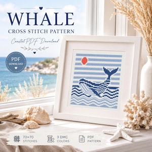 May include: A framed cross-stitch pattern featuring a whale design with blue and white colors. The artwork includes a red sun, blue waves, and the text "WHALE CROSS STITCH PATTERN Coastal PDF Download". The pattern is 70x70 stitches and uses 3 DMC colors.