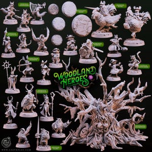 Può includere: Una collezione di figurine in miniatura non dipinte, tra cui creature del bosco e personaggi fantasy. Le figurine sono disposte su una superficie scura, con il testo "Woodland Heroes" ben visibile. Sono raffigurate varie creature, come volpi, conigli e gufi.