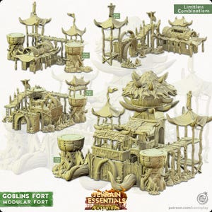 May include: Modular Goblin Fort terrain set in a light tan color. The set includes various structures such as pagodas, bridges, and drum-like towers. The design features intricate details and the text "Limitless Combinations".
