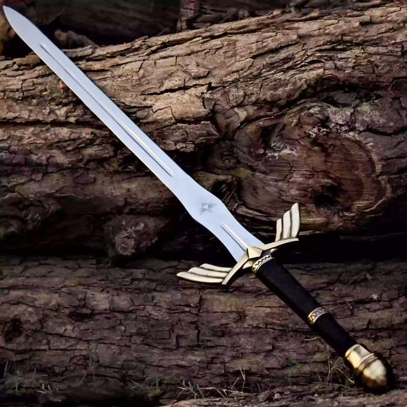 May include: A silver-bladed sword with a gold-colored crossguard and a black handle. The sword features a decorative design on the blade and is set against a textured wooden background. The sword's total length is approximately 30 inches.