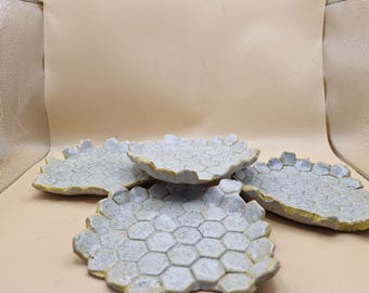 A set of four of handmade Ceramic   side plates