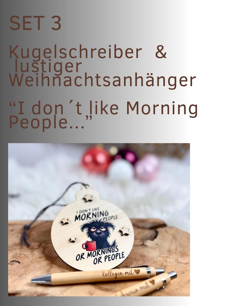 May include: A wooden Christmas ornament with a dog illustration and the text "I don't like Morning People... Or Mornings Or People." Two pens are below the ornament. The ornament is hanging on a string.