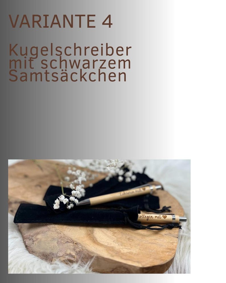 May include: Two wooden pens with engraved text and heart symbols, presented in black velvet pouches. The pens rest on a wooden surface, with the text "VARIANT 4" and "Kugelschreiber mit schwarzem Samts&auml;ckchen" in the background.