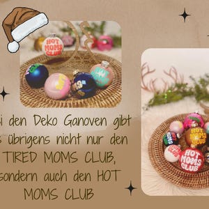 May include: A collection of Christmas ornaments in a woven basket. The ornaments are round and decorated with various colors and the text "HOT MOMS CLUB". A Santa hat graphic is in the upper left corner.