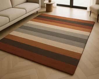 Tappeto in lana trapuntato a mano, con motivi geometrici astratti, stile moderno di metà secolo, colore blu navy e terracotta, ideale per il soggiorno.