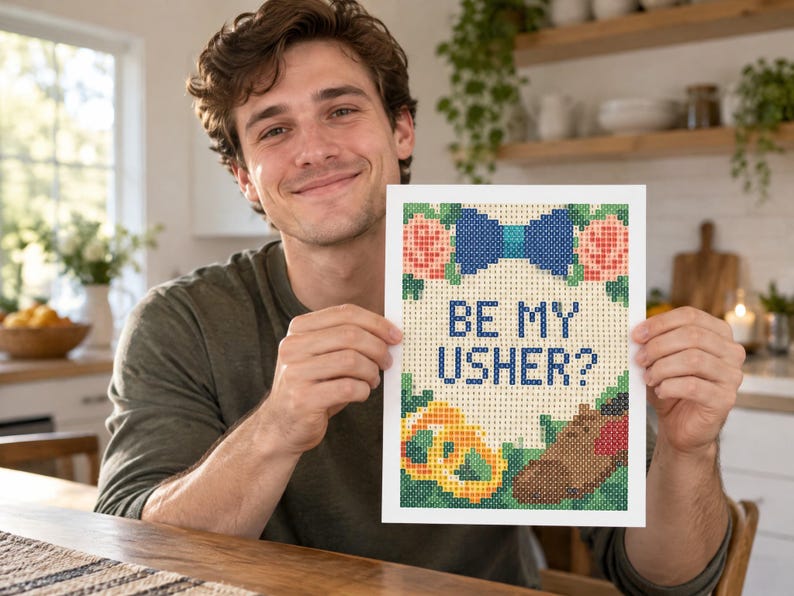 May include: A rectangular diamond painting craft project featuring a white background with the text BE MY USHER? in blue. The design includes a blue bow tie, pink flowers, green leaves, a yellow pretzel, and a brown dress shoe in a pixelated style.