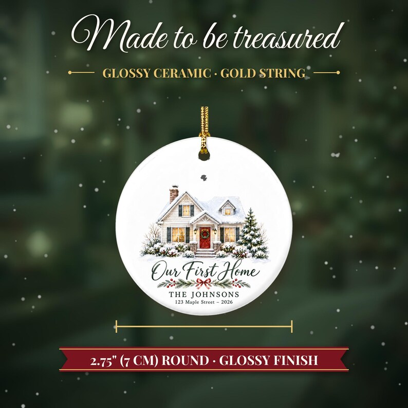 May include: A round white glossy ceramic ornament featuring a house illustration, the text "Our First Home", "THE JOHNSONS", and "123 Maple Street - 2026". It includes a gold string and measures 2.75 inches in diameter.
