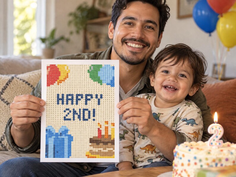 Puede incluir: Un proyecto de manualidades de pintura de diamantes rectangular con un dise&ntilde;o pixelado que muestra el texto HAPPY 2ND! en azul, rodeado de globos de colores, una caja de regalo azul y un pastel de cumplea&ntilde;os con tres velas encendidas.