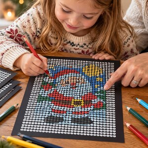 May include: A paint-by-number kit featuring a Santa Claus illustration on a black background with numbered circles. The kit includes a red pencil, several colored pencils, and a white mug with a red tree print, all arranged on a wooden surface.