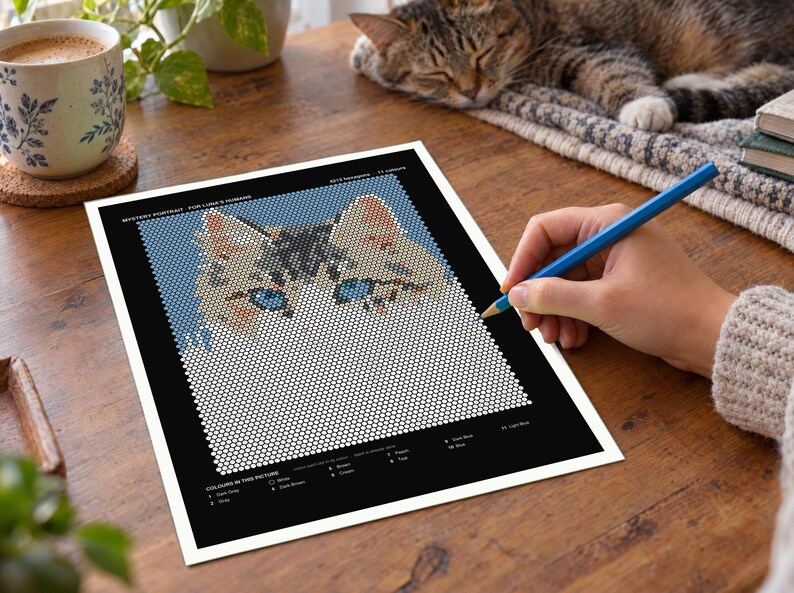 May include: A mystery portrait activity sheet featuring a grid of white circles that form a cat's face with blue eyes and brown ears. The black border includes a color key with labels like White, Dark Gray, Pink, Brown, Green, Peach, Teal, Dark Blue, Blue, and Light Blue.