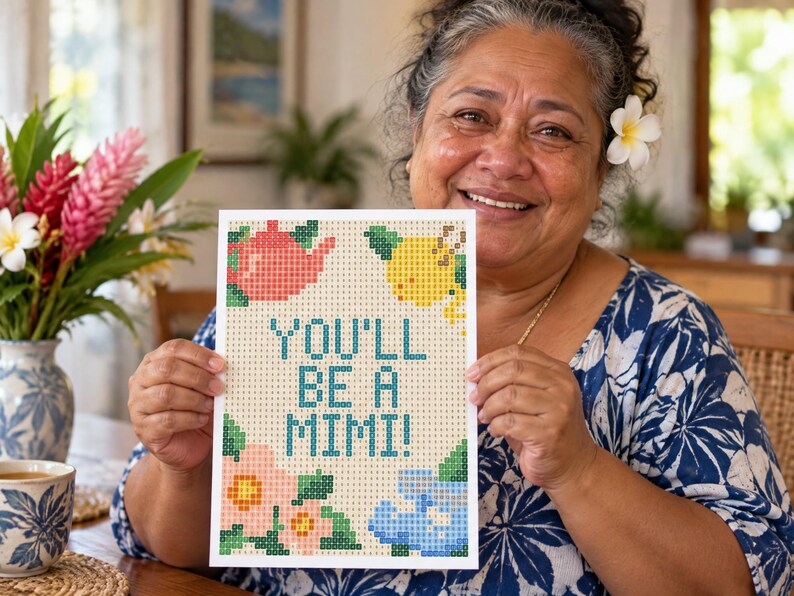 May include: A rectangular card featuring a pixelated design with the text YOU'LL BE A MIMI! in teal. The design includes a pink teapot, a yellow lemon, a pink flower, and a blue floral shape, all set against a light beige grid background.
