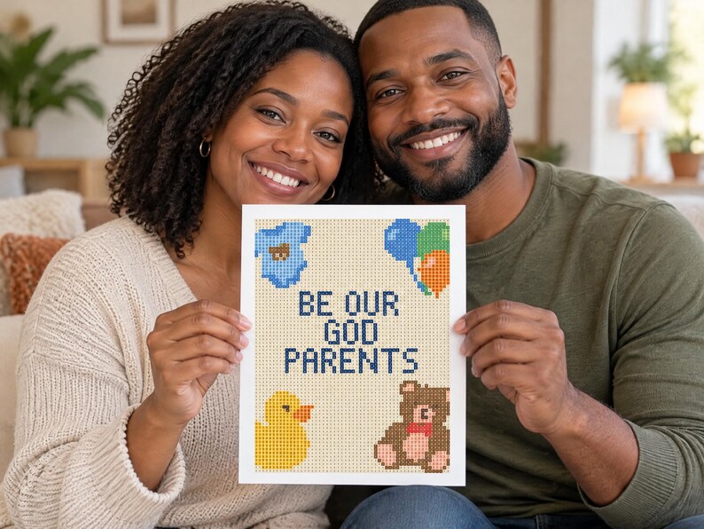 May include: A rectangular white card featuring a cross-stitch style design with the text BE OUR GOD PARENTS in dark blue. The design includes a blue baby onesie, a cluster of blue, green, and orange balloons, a yellow rubber duck, and a brown teddy bear.