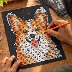 May include: A diamond painting kit featuring a portrait of a Corgi dog on a black background. The image is composed of small, numbered circular facets in shades of orange, white, and black, creating a mosaic effect of the dog's face.
