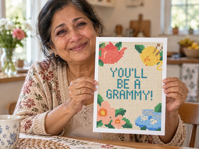 May include: A rectangular diamond painting craft project featuring a beige background with the text YOU'LL BE A GRAMMY! in teal. The design includes a red teapot, a yellow lemon, pink flowers, and blue flowers, all rendered in a pixelated grid style.