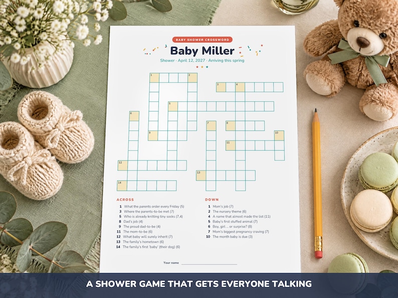 May include: A white paper baby shower crossword game titled Baby Miller with the date April 12, 2027. The game features numbered clues for across and down sections, a blank line for a name, and a grid of empty boxes for filling in answers.