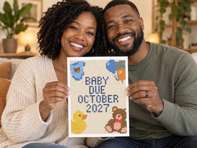 May include: A rectangular diamond painting craft featuring the text BABY DUE OCTOBER 2027 in dark blue. The design includes a blue baby onesie, a cluster of blue and orange balloons, a yellow rubber duck, and a brown teddy bear on a light background.
