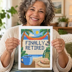 May include: A rectangular diamond painting craft project featuring a beach scene with palm trees, a hammock, and a blue mug. The text FINALLY RETIRED is printed in dark blue block letters in the center of the image against a light background.