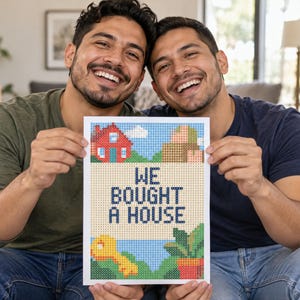 May include: A rectangular print featuring a pixel art design with a red house, brown boxes, a yellow key, and a green potted plant. The text WE BOUGHT A HOUSE is printed in dark blue pixelated letters in the center of the white-bordered artwork.