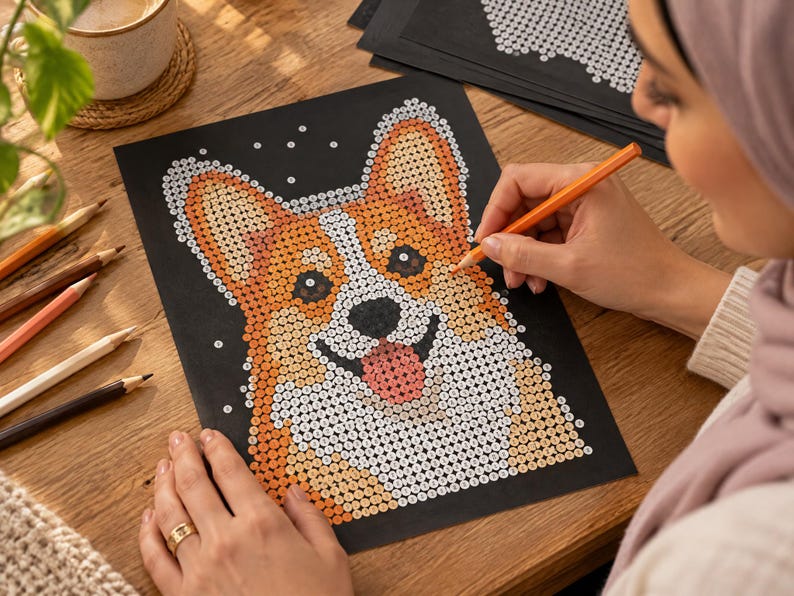 May include: A paint-by-number activity sheet on black paper featuring a Corgi dog illustration. The design is composed of small numbered circles in shades of orange, white, black, and pink, waiting to be filled with color to complete the portrait.