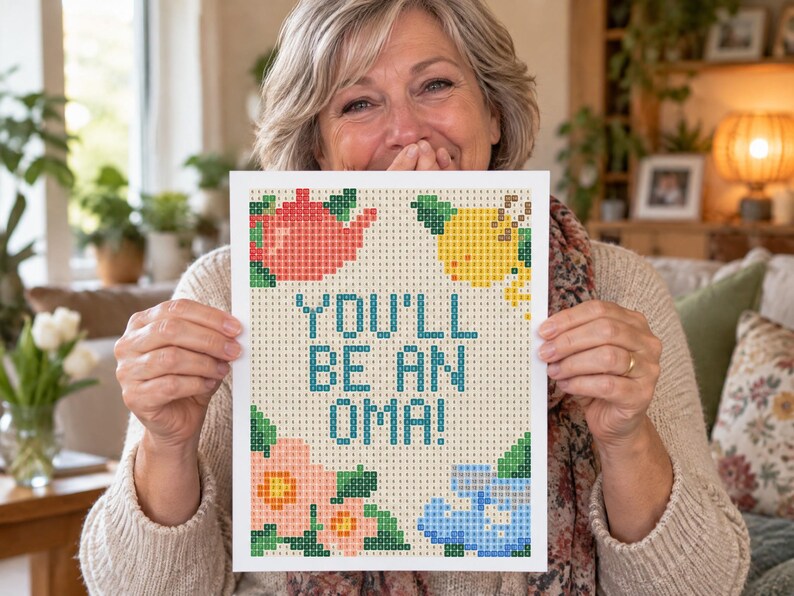 May include: A rectangular diamond painting canvas featuring a grid pattern with the text YOU'LL BE AN OMA! in blue. The design includes a red teapot, a yellow lemon, and pink and blue flowers, all composed of small squares with letter codes.