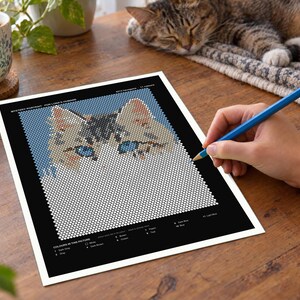 May include: A mystery portrait activity sheet featuring a grid of white circles that form a cat's face with blue eyes and brown ears. The black border includes a color key with labels like White, Dark Gray, Pink, Brown, Green, Peach, Teal, Dark Blue, Blue, and Light Blue.