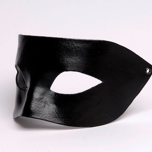 Venetian mask. Black mask. Leather mask