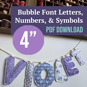 Pode incluir: Uma faixa de tecido soletrando a palavra VIOLET em letras de estilo bolha. Cada letra apresenta tecido estampado em tons de roxo, azul e branco com bordas costuradas, suspensa em um cordão branco. Texto: Bubble Font Letters, Numbers, & Symbols 4” PDF DOWNLOAD.